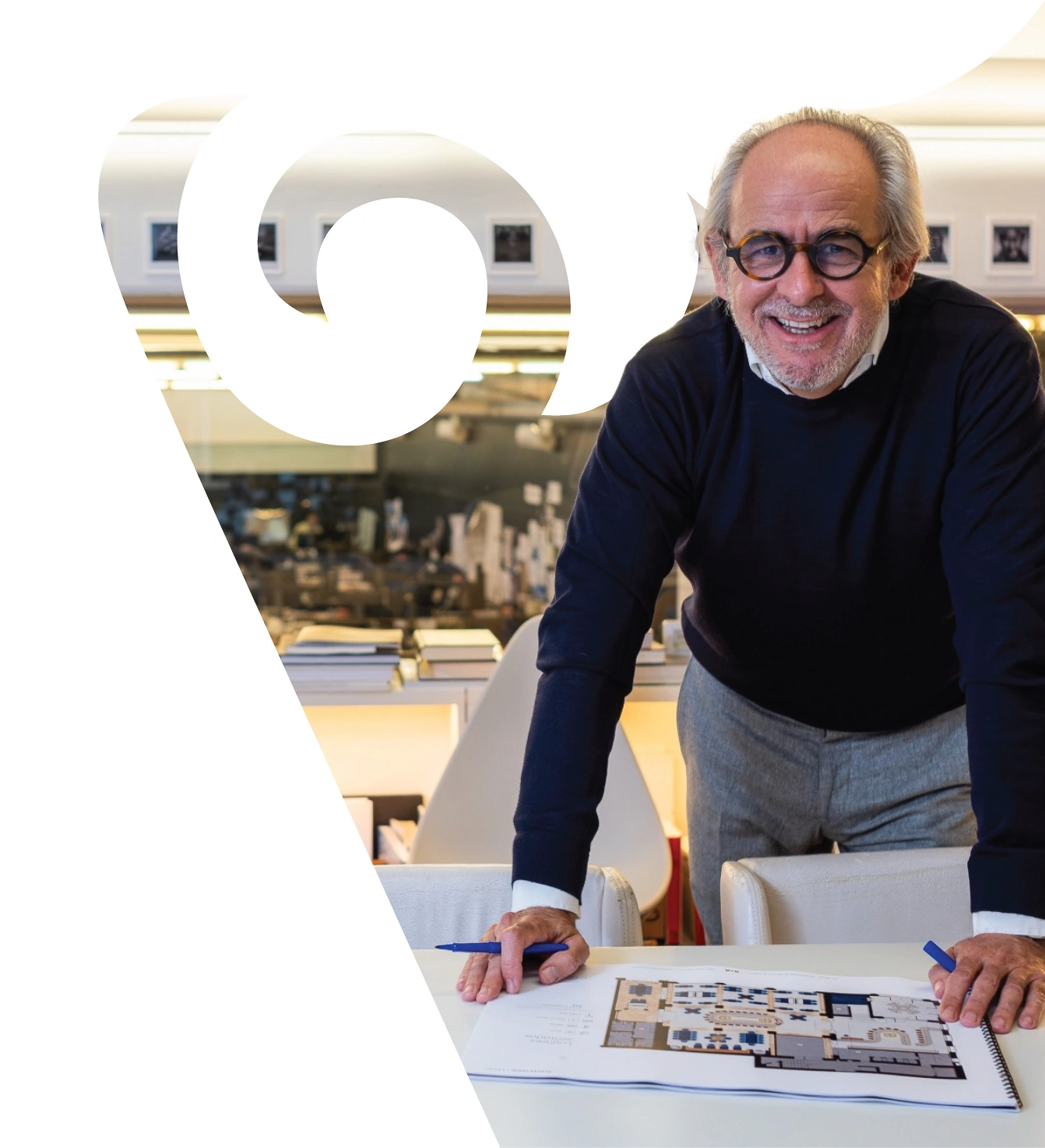Miguel Saraiva reviewing floor plans at the Saraiva + Associados studio