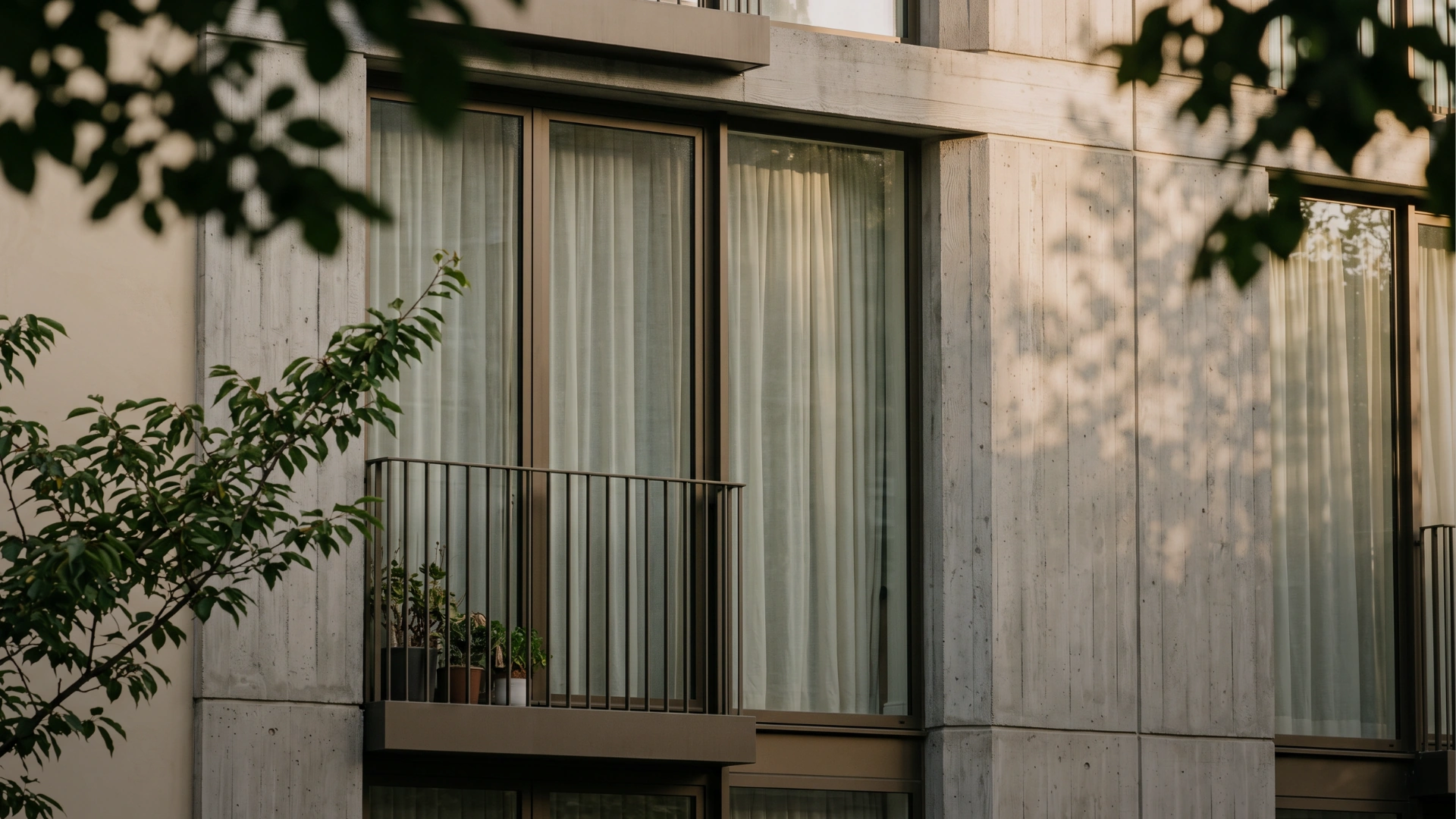 Timber and concrete façade with planted balconies