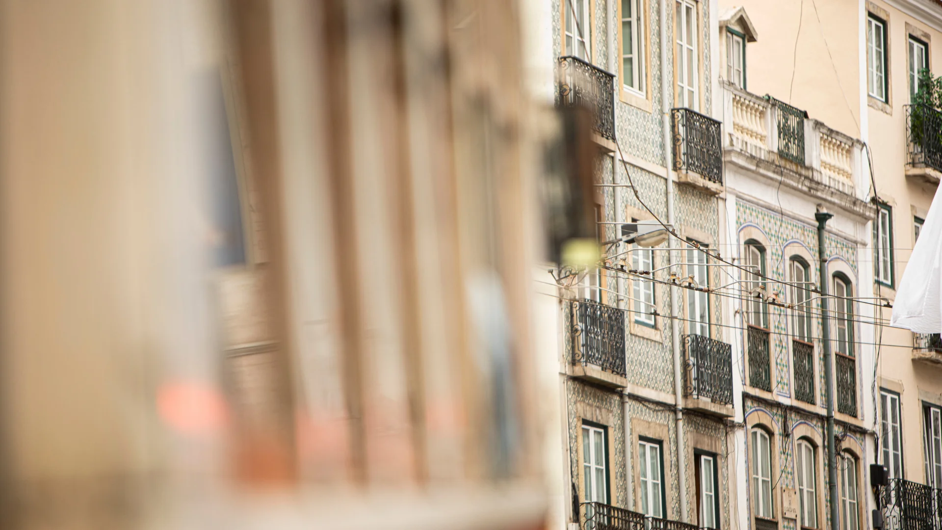 Tiled façades and wrought-iron balconies on a Lapa street